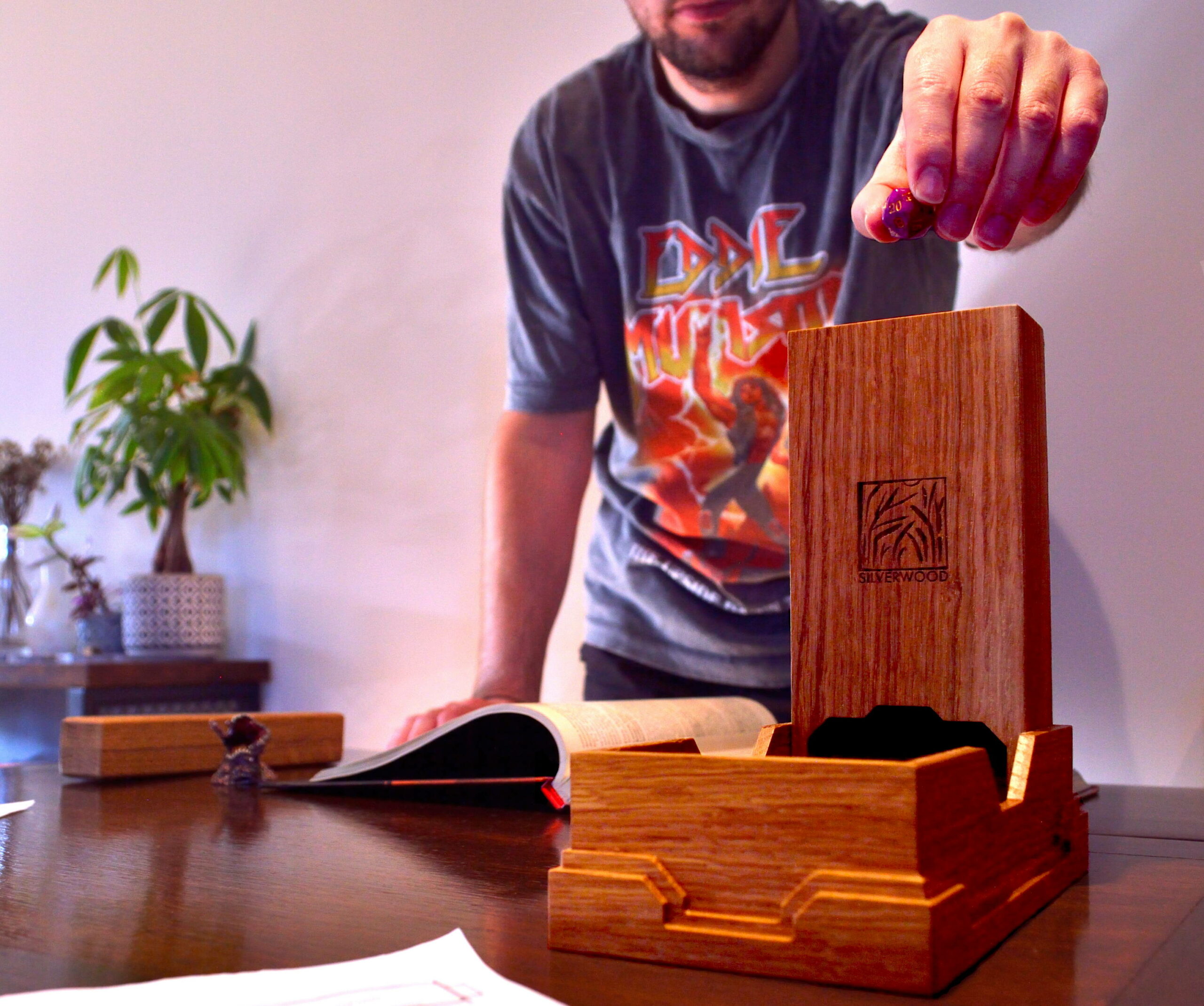 Dropping a D20 into an Oak Stout-Heart Dice Tower from our range of tabletop gaming accessories.