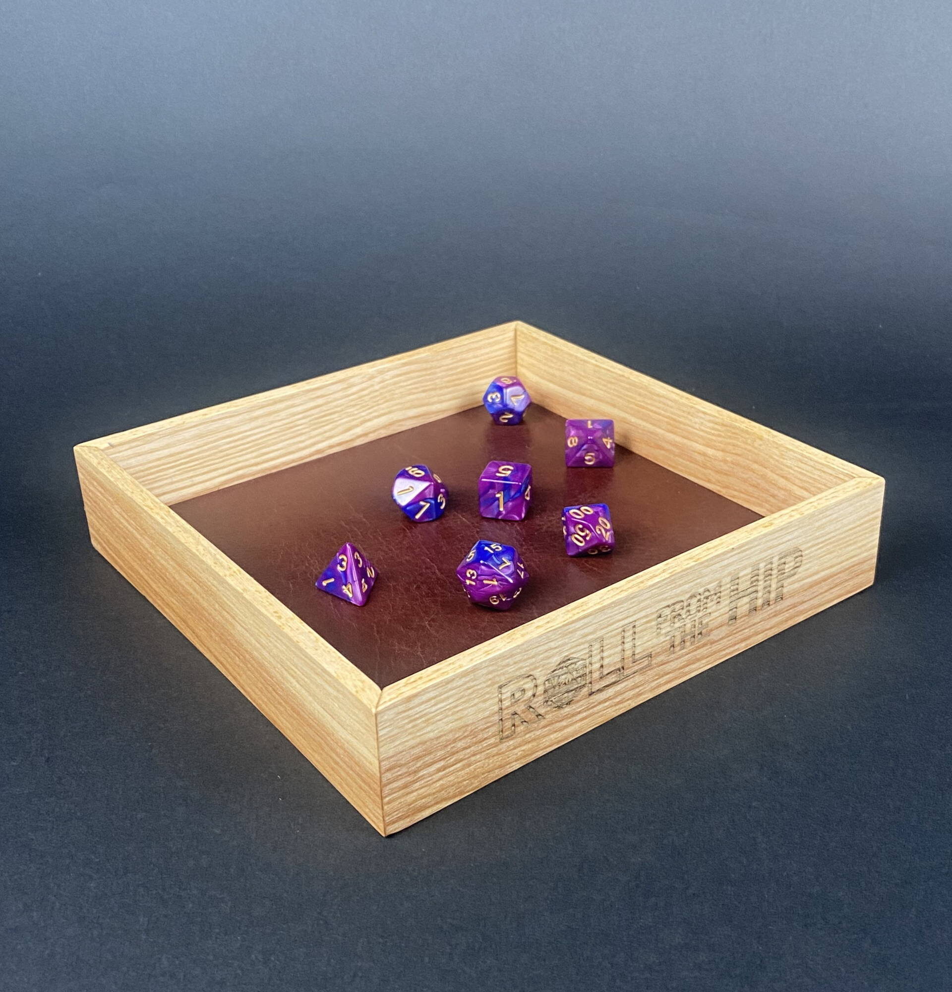 Roll From The Hip branded Ash Dice Tray (shown with dice) by Silverwood Gaming