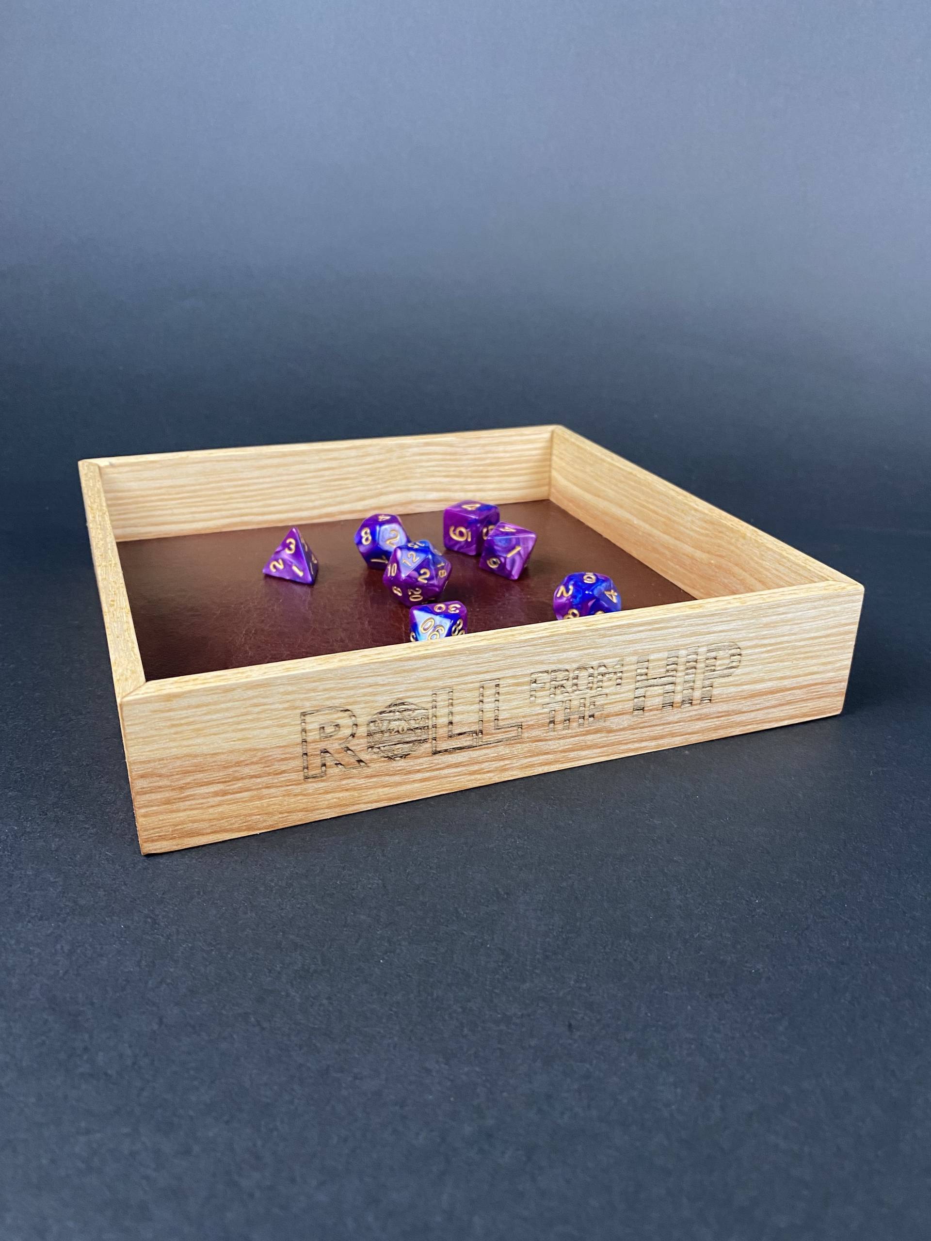 Roll From The Hip branded Ash Dice Tray (shown with dice) by Silverwood Gaming. Brand on display more fully