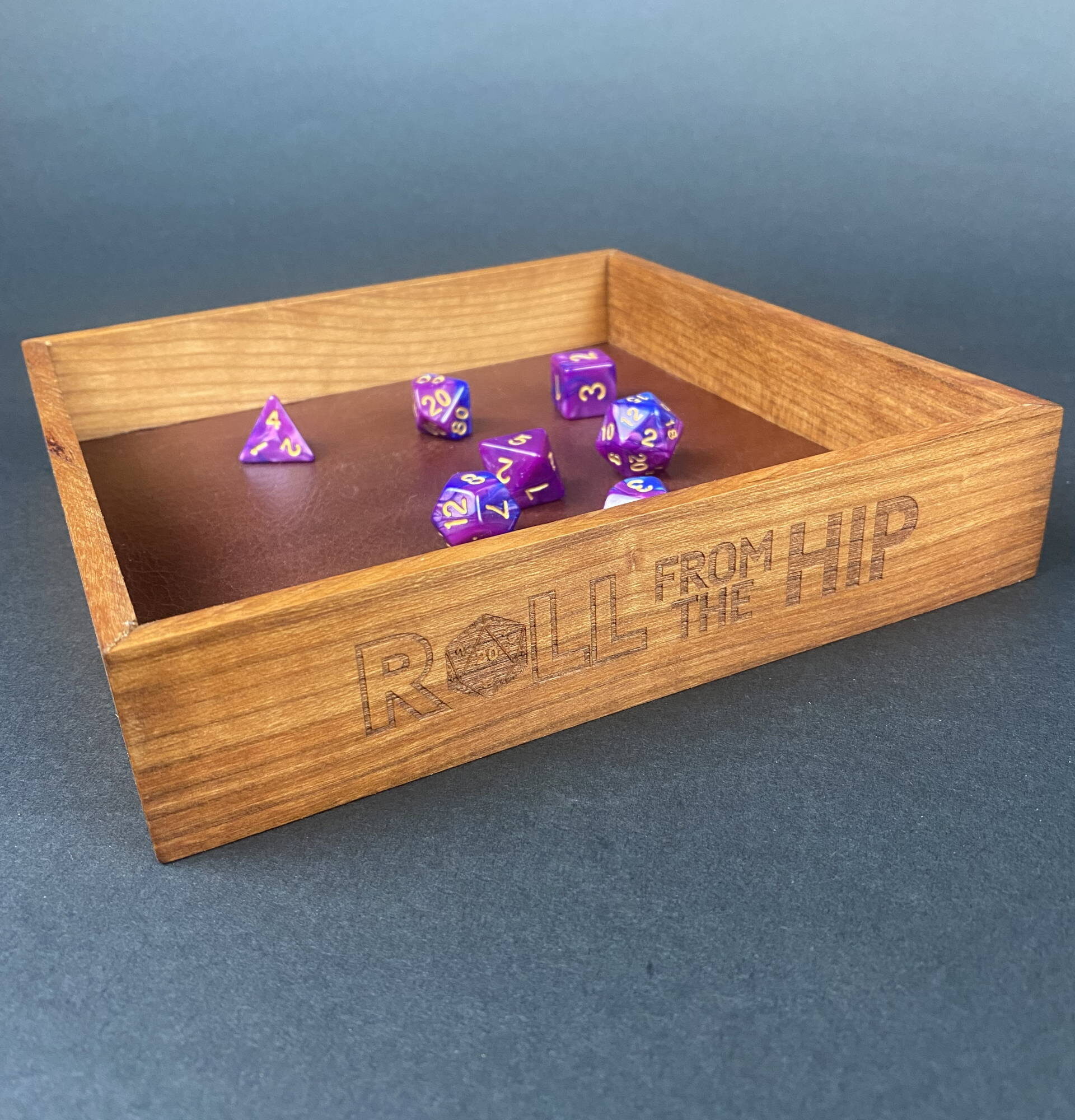 DYCRFTH2 Roll From The Hip branded Cherry Dice Tray (shown with dice) by Silverwood Gaming. Brand on display more fully