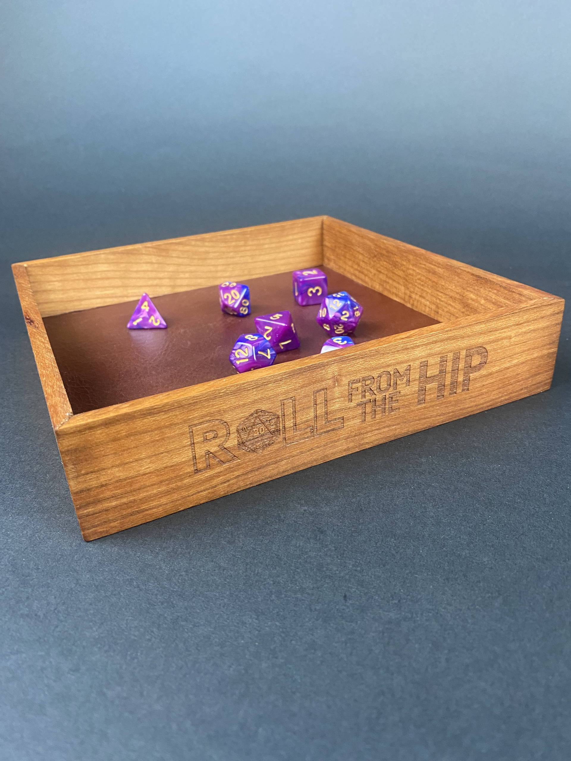 DYCRFTH2 Roll From The Hip branded Cherry Dice Tray (shown with dice) by Silverwood Gaming. Brand on display more fully